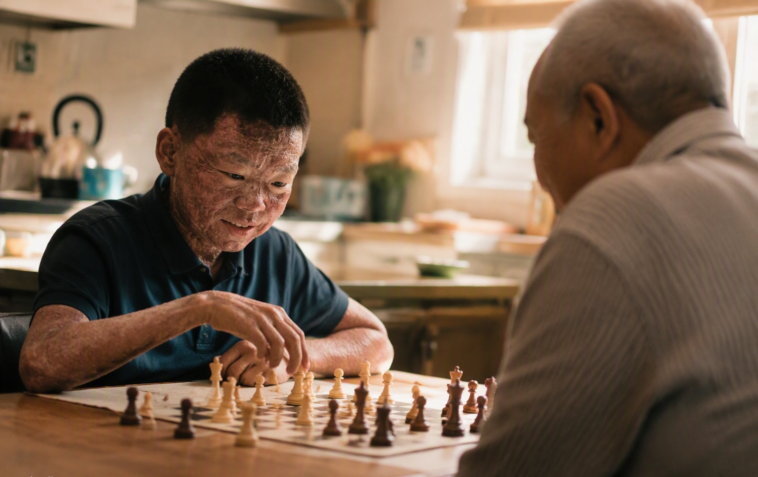 An elderly man in a Sunday suit and hat speaking into a microphone at a rare disease research fundraiser